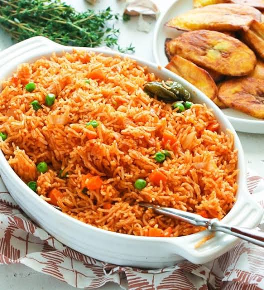 Jollof Rice stands at the heart of Nigerian cuisine. It’s one of the most popular dishes in West Africa, known for its vibrant color and rich flavor